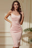 Woman wearing a pink ruched midi dress with spaghetti straps