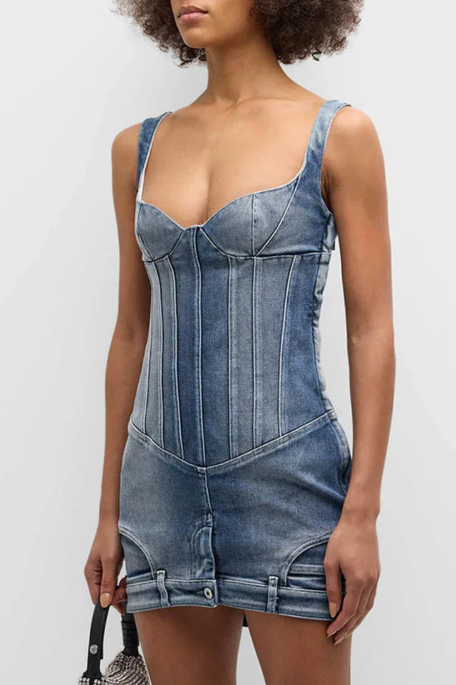 Close-up of the blue denim corset mini dress, showing the paneled bodice and sweetheart neckline. Secondary image