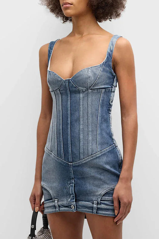 Close-up of the blue denim corset mini dress, showing the paneled bodice and sweetheart neckline.