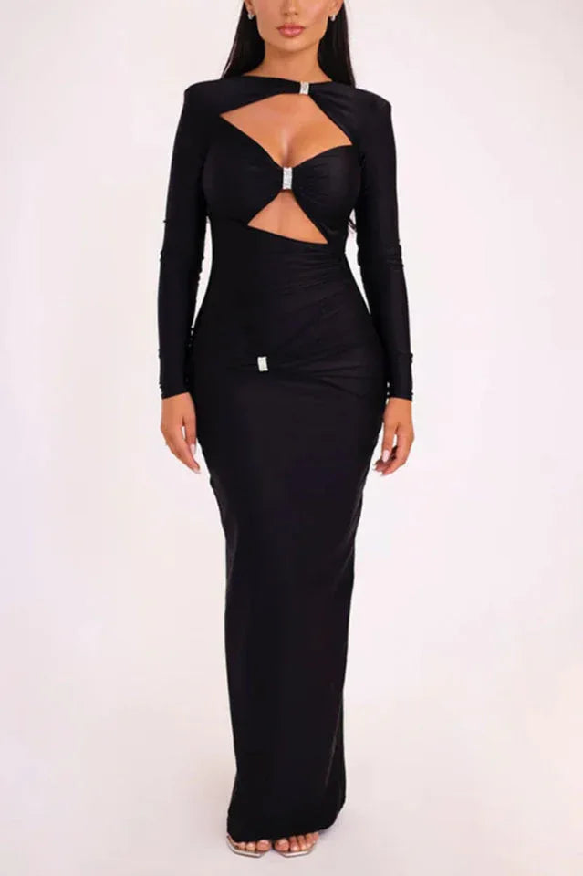 Woman wearing a black long-sleeved maxi dress with a keyhole neckline and cut-out detail. Main image