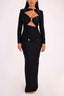 Woman wearing a black long-sleeved maxi dress with a keyhole neckline and cut-out detail.