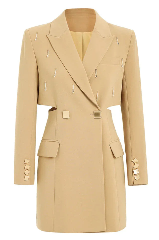 Studio shot of a tan double-breasted blazer dress with cut-out sides and gold-tone buttons.