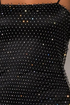 Close-up of the rhinestone embellishments on the black dress