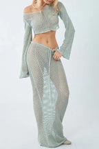 Close-up of a woman wearing a light blue crochet knit crop top and maxi skirt set, showing the drawstring detail.