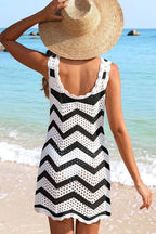 Close-up of a black and white chevron crochet knit dress on a woman at the beach.