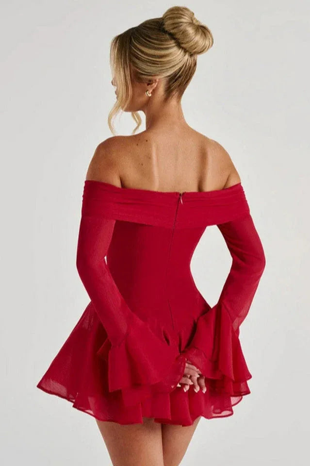 Back view of a woman in a red off-the-shoulder dress with flared sleeves Secondary image