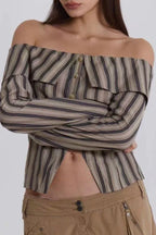 Close-up of a model's midriff showing the detail of an off-the-shoulder striped top