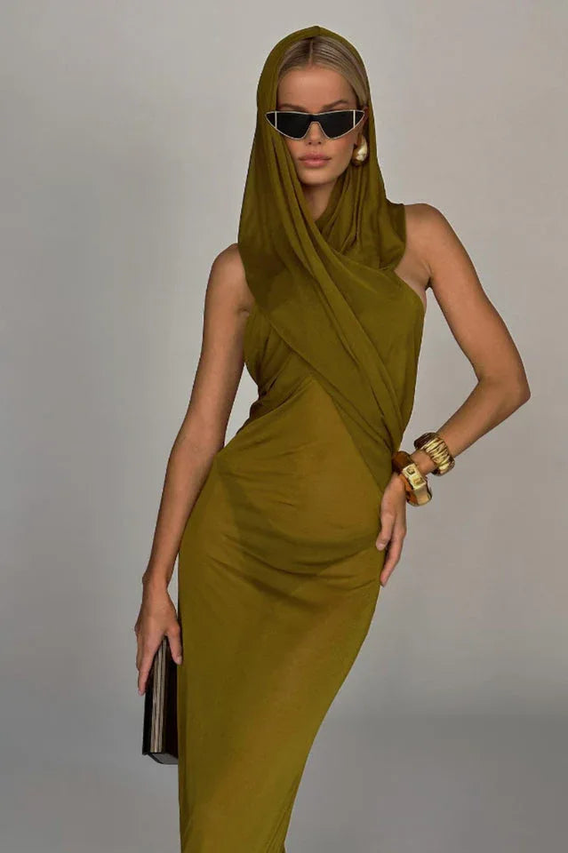 Close-up of a model in an olive green hooded maxi dress, showcasing the draped neckline and sheer skirt.