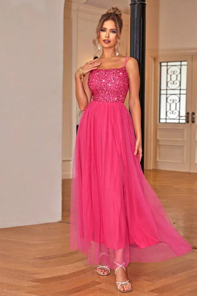 woman in a hot pink sequined and tulle evening gown