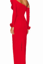 Back view of a red column gown with a center back slit and rose embellishments on the shoulder.