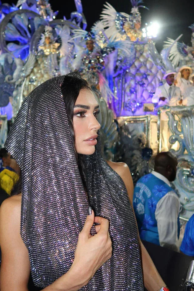 Woman with a hooded metallic top at an event