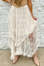 Close-up of a white lace tiered ruffle skirt with an asymmetrical hemline.