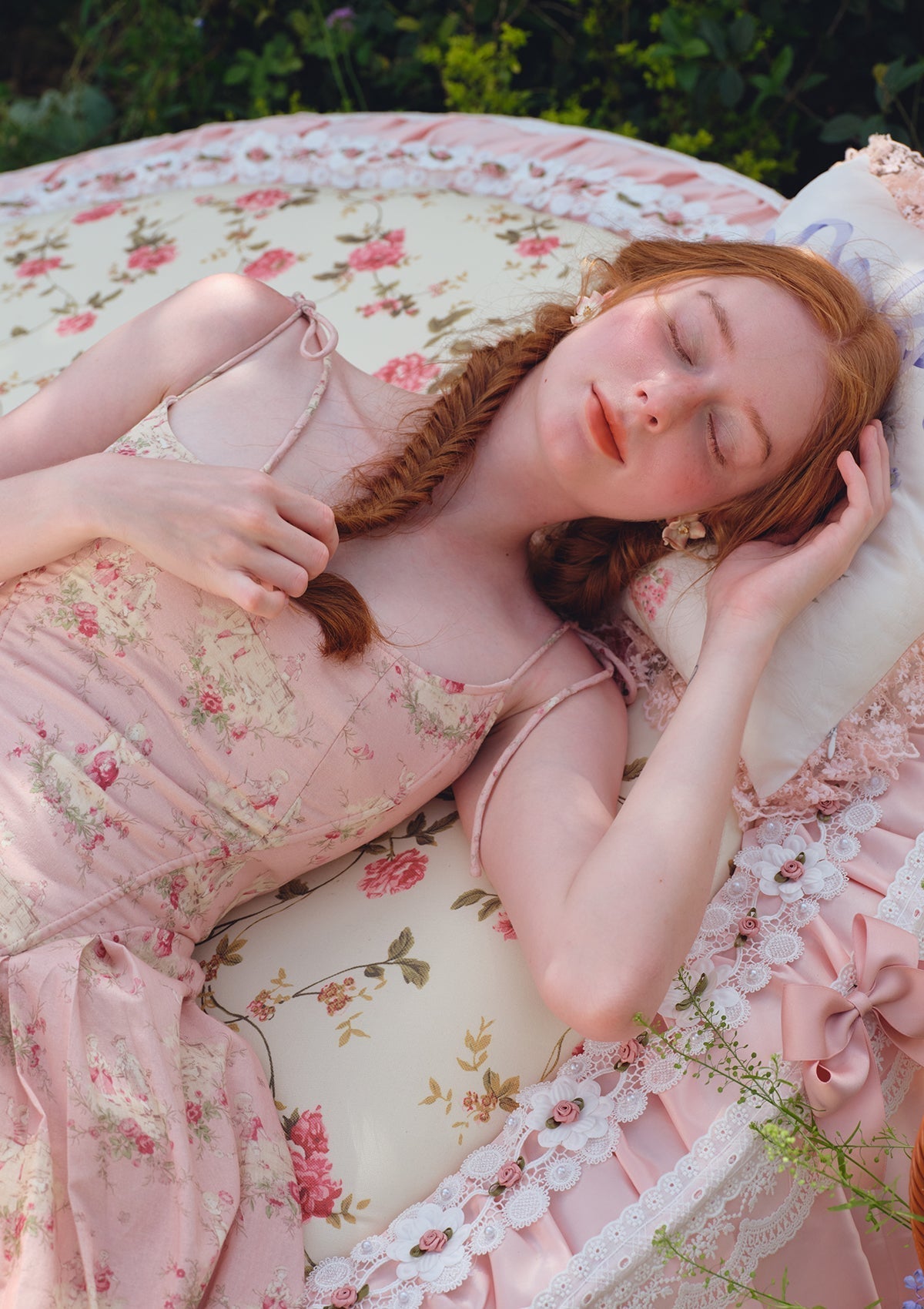 Close-up of the floral print on the pink midi dress