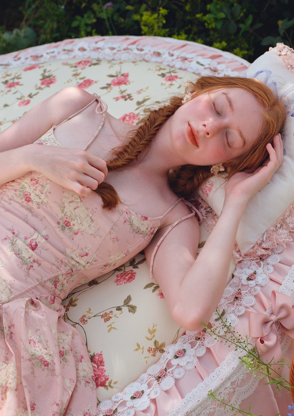 Close-up of the floral print on the pink midi dress