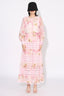 Woman wearing a pink floral print maxi dress from the front