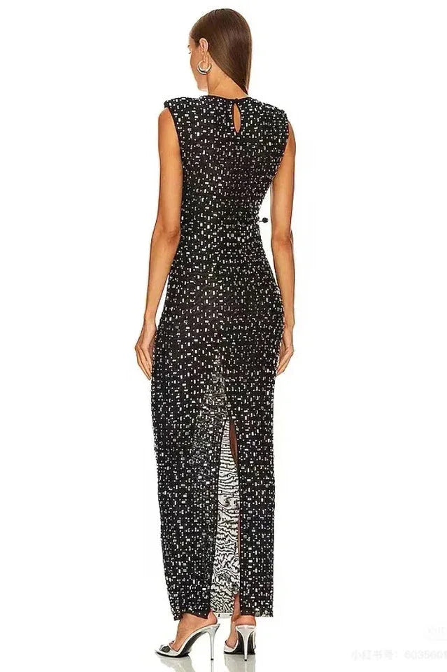 Back view of a black sequined dress with a keyhole back and a high slit