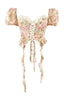 Product image of a floral print corset top with puffy sleeves, lace trim, and a lace-up front.