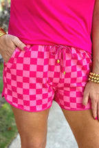 Close-up of pink checkerboard shorts with drawstring