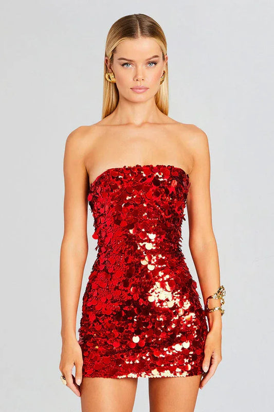 Woman wearing a red sequined strapless mini dress, front close-up