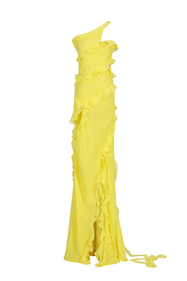 A yellow one-shoulder ruffled gown displayed on a mannequin, emphasizing its draped silhouette and flowing fabric.