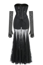 Black lace corset gown with sheer skirt and long sleeves from the back laid flat
