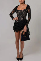 Full body shot of a woman in a black lace mini dress with a corset bodice
