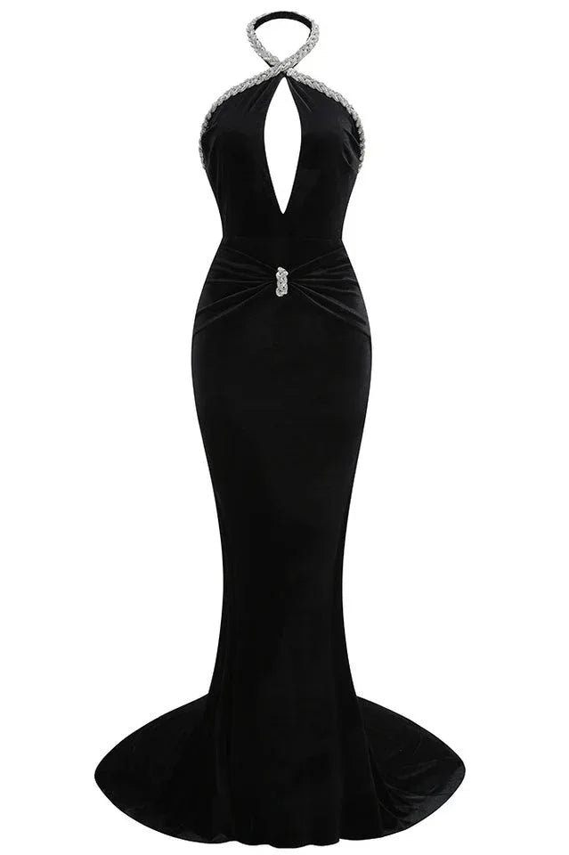 Front view of a black velvet mermaid gown with a deep V-neck and embellished halter neckline.