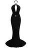 Front view of a black velvet mermaid gown with a deep V-neck and embellished halter neckline.