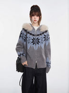 Woman wearing a grey and blue Fair Isle knit zip-up cardigan with a faux fur trim hood and black wide-leg jeans