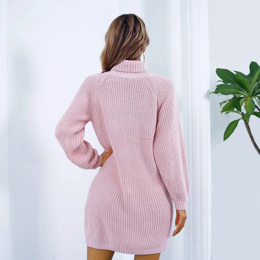 Back view of a woman wearing a pink knit turtleneck mini dress