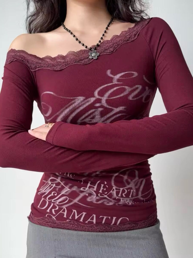 Model with arms crossed wearing the burgundy top and grey skirt.