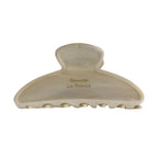 A single cream-colored claw clip with "Barrette La France" inscribed on it.