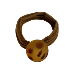 Brown fabric hair tie with a round, leopard print charm.