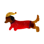 Red dachshund wearing a red sweater and a yellow polka dot hat