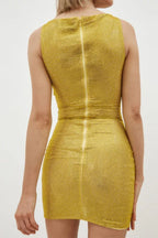 Back view of a woman wearing a gold metallic knit mini dress with a zipper closure