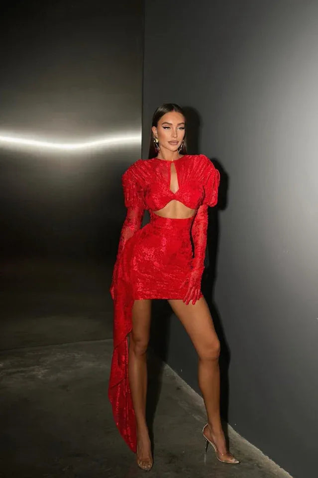 Woman in a red mini dress with cut-out and puffed sleeves
