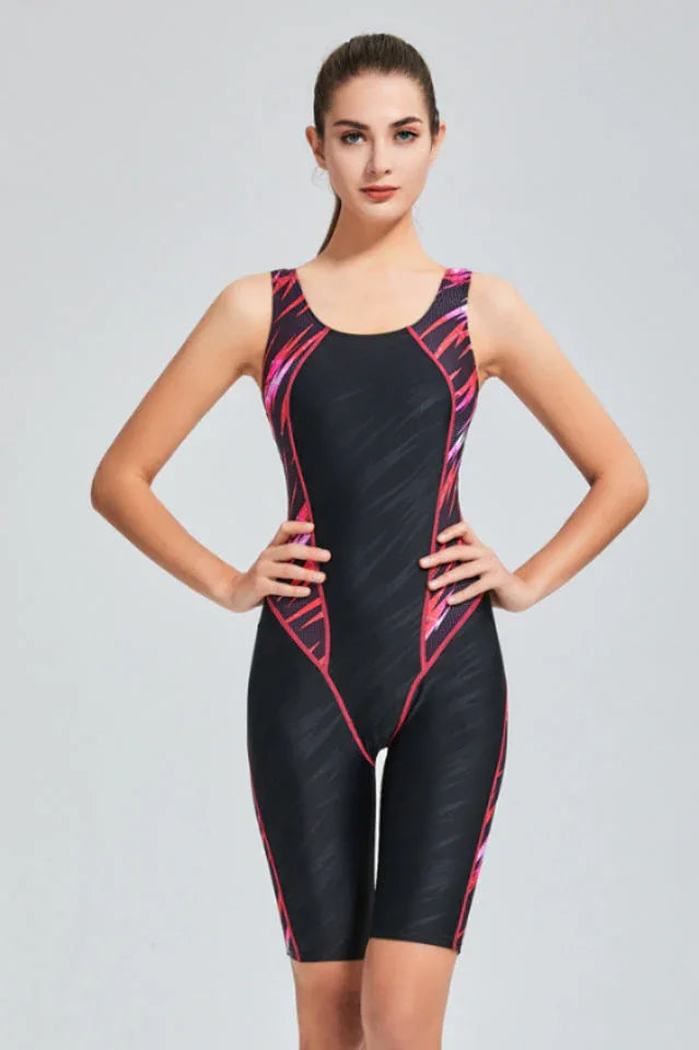 woman in black and pink patterned athletic swimsuit Secondary image