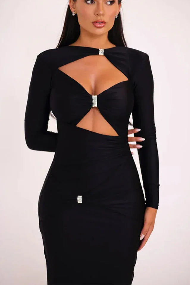 Close-up of the bodice of a black long-sleeved maxi dress, showing the keyhole and cut-out details.