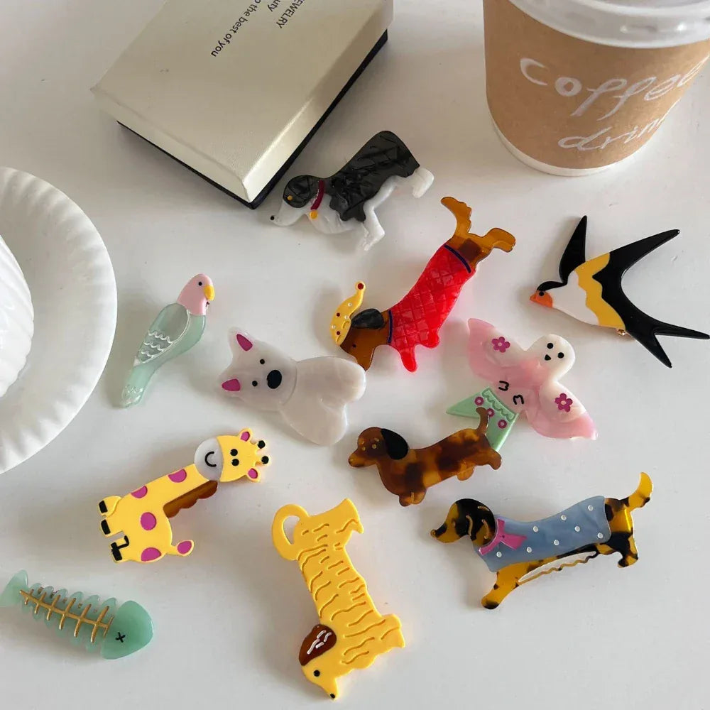 Assortment of acrylic animal-shaped hair accessories on a table