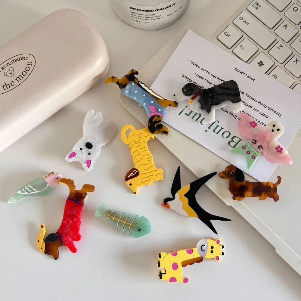 Desk scene with various acrylic animal charms and office supplies