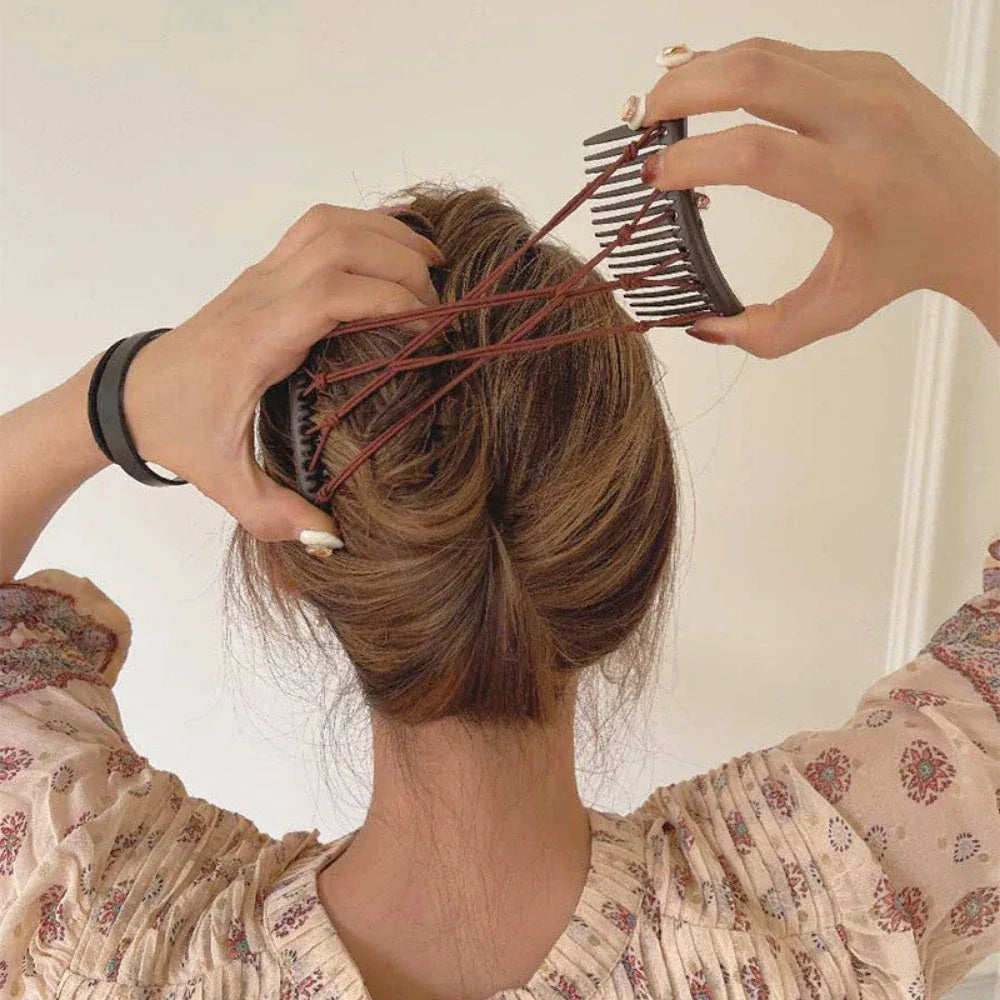 person using interlocking combs to style hair into a bun
