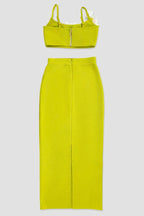 Back view of a lime green crop top with floral embellishments and a matching midi skirt, displayed separately.