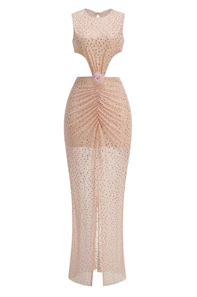 front detail of a blush pink sequined gown with ruched waist, cut-outs, and floral embellishment