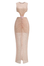 front detail of a blush pink sequined gown with ruched waist, cut-outs, and floral embellishment