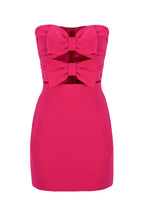 Front view of a pink strapless mini dress with a fitted bodice adorned with two large bows and a simple skirt.
