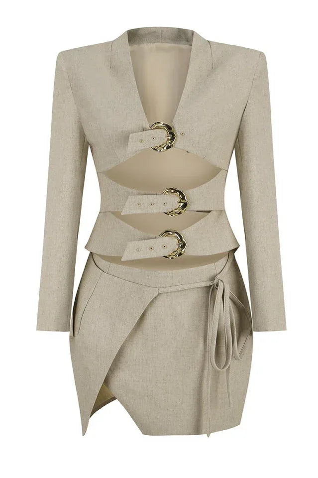 Full product shot of a beige blazer dress with cut-out details and buckle closures.