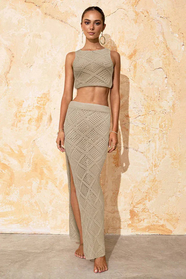 Woman wearing a beige knit crop top and maxi skirt with a high slit, front view Main image