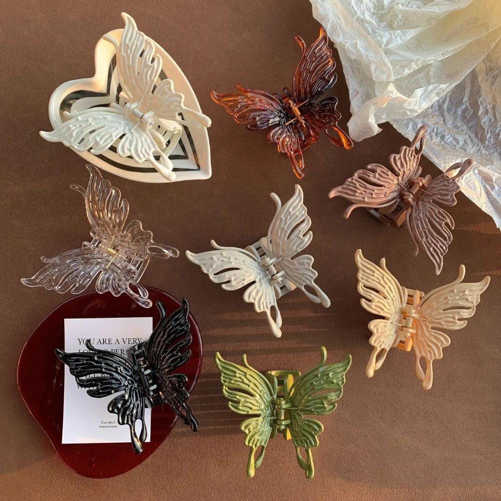 assortment of butterfly hair clips arranged on a surface