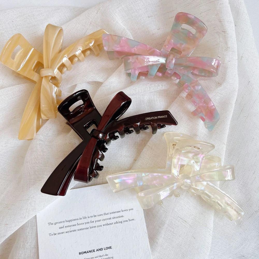 Assortment of marbled bow claw hair clips in various colors