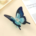 Detailed view of a blue butterfly hair claw clip